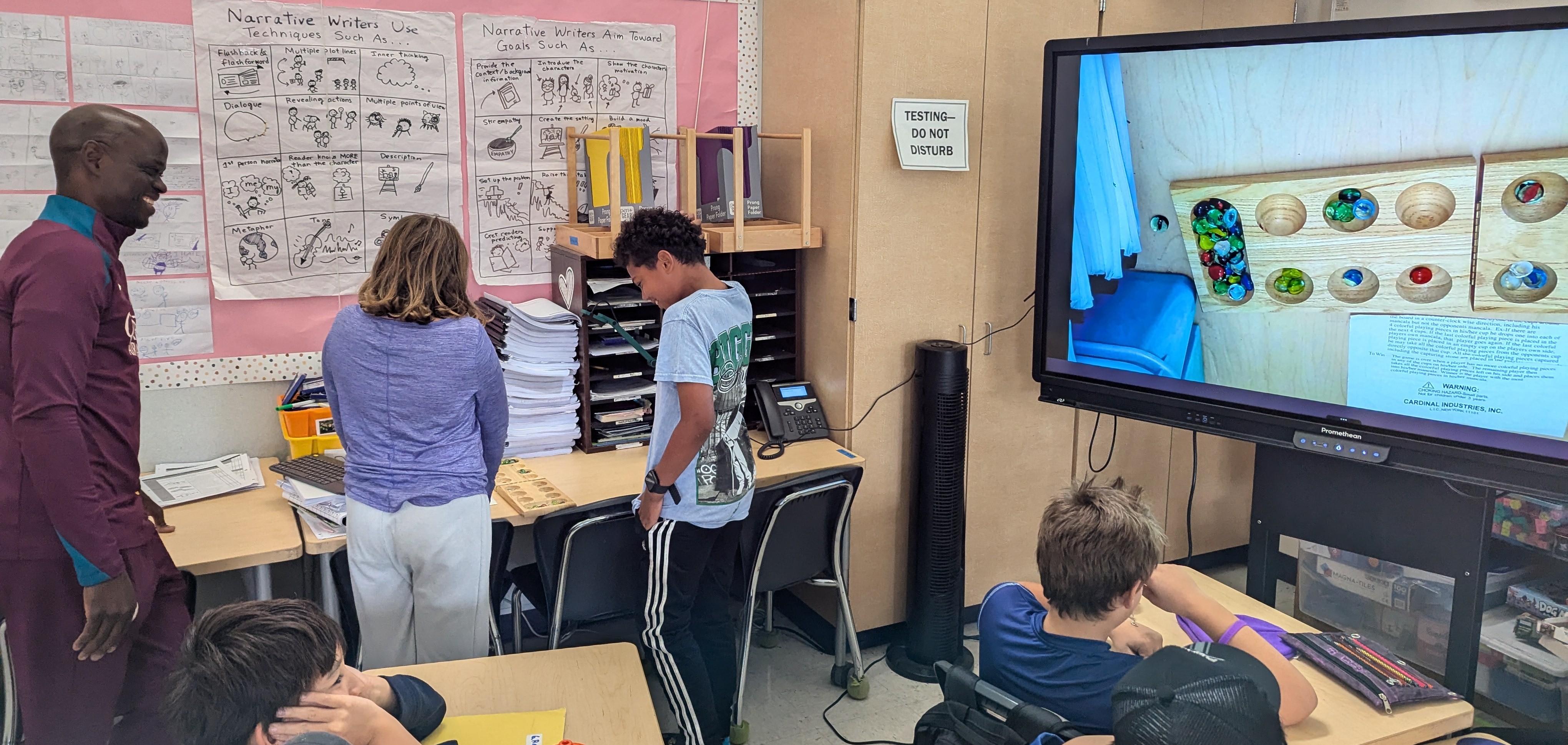 Teaching the Venda game of Mufuvha at Harding Elementary